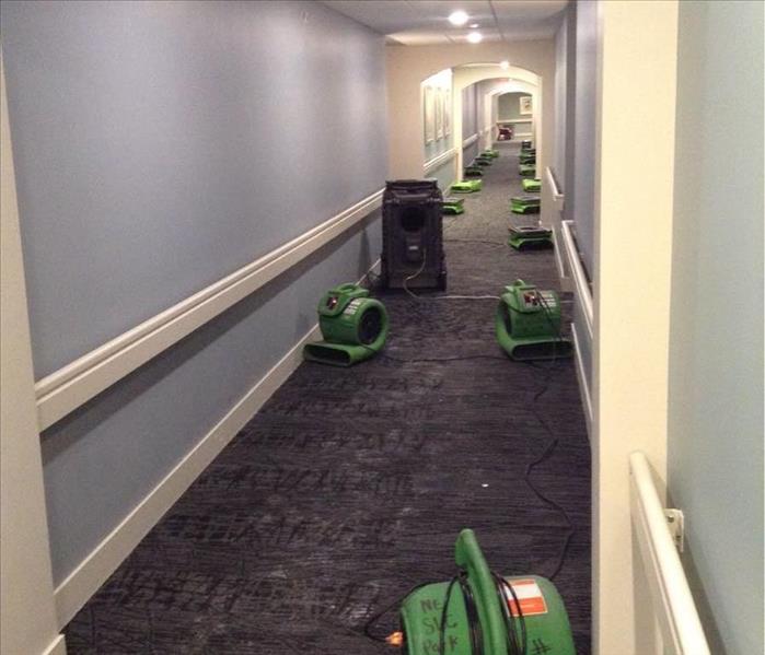 Business hall flooded, SERVPRO drying equipment placed to dry carpets.