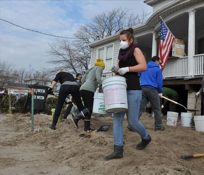 The Federal Emergency Management Agency (FEMA) working on a home affected by a storm disaster.