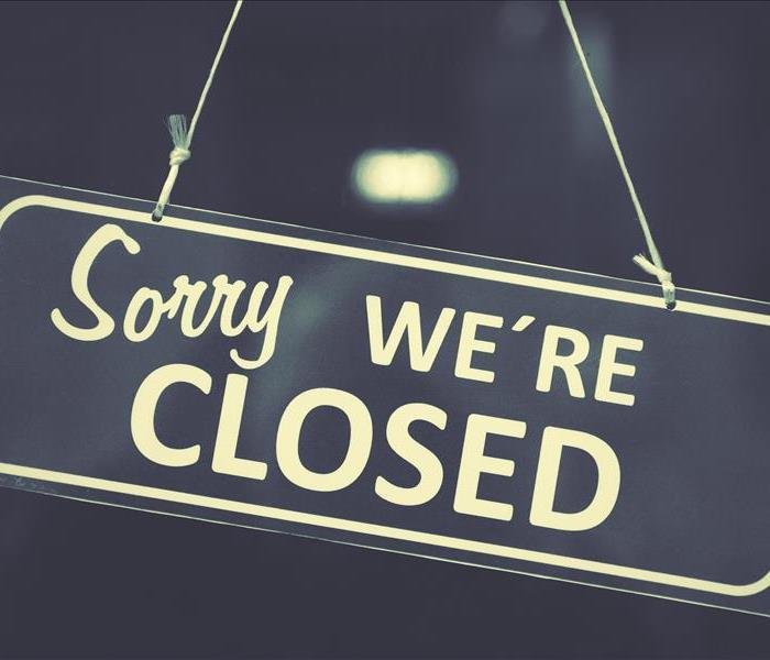 Image of a sign saying "Sorry we're closed"